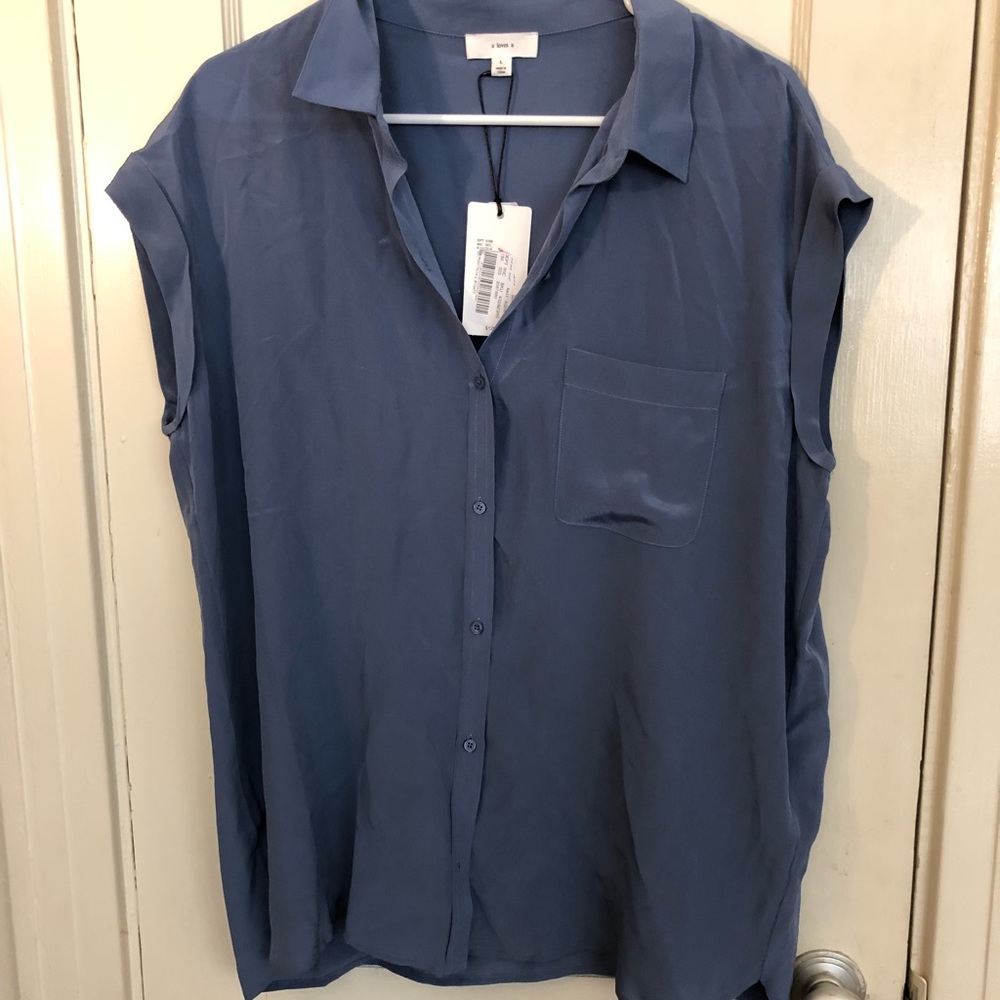 100% silk blue top with cap sleeves. a loves a